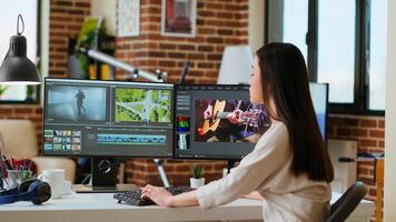 Female filmmaker working on post production from home office, editing timelines and color grading for a shoot. Tech driven workspace showcases a digital workflow for production. Camera B. photo
