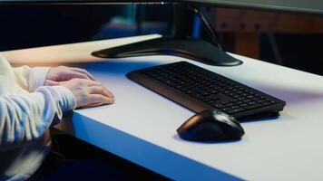 Teleworking computer technician typing on keyboard, implementing security measures to protect company systems and data, close up. Remote IT employee at home debugging code for software, camera A photo
