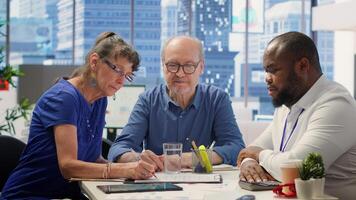 Senior citizens consulting a financial planner about retirement planning, ensuring their savings and investments are optimized for future financial stability. Planning to invest money. Camera A. photo