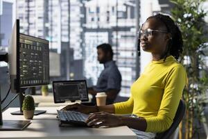 Machine learning infrastructure engineer designing and developing algorithms that enable machines to learn from data. Woman in office training and deploying large scale deep learning models photo