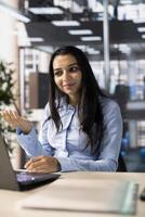 Company executive hosts an online meeting to discuss business operations and performance metrics. conference enables real time collaboration and goal setting for the enterprise. photo