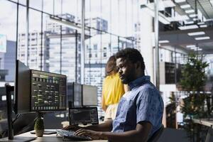 Programmer developing and maintaining machine learning APIs solving complex problems. Man training predictive models capable of handling tasks such as language processing and predictive analytics photo