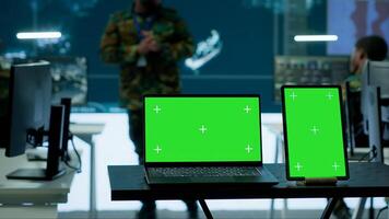 Military expert in an advanced operations center oversees satellite intelligence, surveillance systems on computer. Interpreting data to ensure national defense and strategic decisions. Camera A. photo