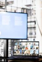 Focus on laptop showing board of directors holding teleconference meeting with job candidate, asking questions and presenting company. Close up of HR employees conducting interviews during call photo