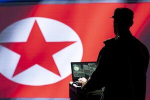Intelligence officer isolated over North Korea flag monitoring zone of interest using radar. Pyongyang regime operative engaged in surveillance mission using laptop, looking at world map photo