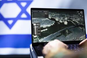 Mossad agent using laptop device, operating anti ballistic system designed to counter missiles threatening country. Close up shot of Israeli counterintelligence officer defending against rockets photo