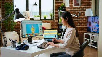 Freelance designer works on a photo editing project in a remote office, using advanced design software. Home workspace promotes creativity and innovation for online work. Camera A.