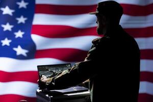 American army operative conducts tactical reconnaissance, utilizing laptop for data analysis and mission planning. US Air Force agent looking at aerial map on screen, pinpointing targets photo