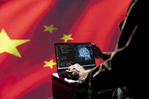Chinese software developer making bot accounts on social networks using AI machine learning. Engineer working for CCP government building artificial intelligence algorithms to spread misinformation photo