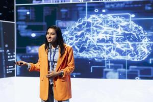 Smiling specialist talking at global conference, exploring subjects such as enterprise AI, machine learning, security, ethical AI, deep learning, data ecosystems and natural language processing photo