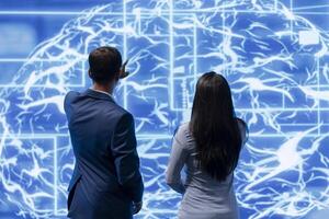 Coworkers doing brainstorming, using AR visualization to fix artificial intelligence neural networks. High tech workspace colleagues using AI system aiding in processing and transmitting information photo
