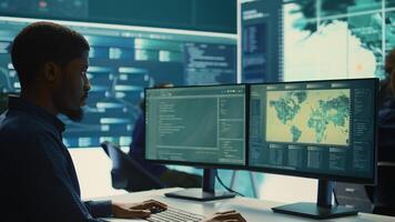 Cyber security experts team working on encryption and IT security in a governmental agency. Specialists working on cyber operations, network security and data protection for national safety. Camera B. photo