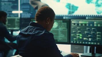 Cyber security expert working on encryption and IT security in a governmental agency. Woman engaging on cyber operations, network security and data protection for hybrid war. Camera A. photo