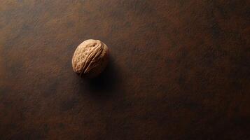 A walnut on a brown surface photo