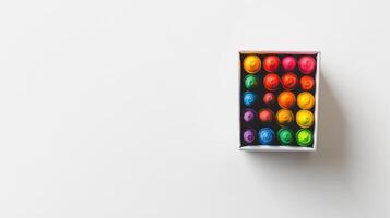 Colorful crayons arranged neatly in a box on a white background showcasing a range of vibrant shades for artistic creativity photo