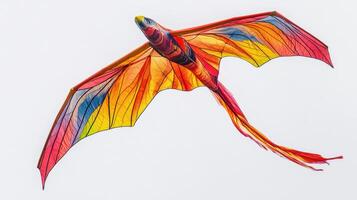 Colorful kite soaring against a clear blue sky during a bright sunny day, capturing the essence of joyful outdoor activity photo