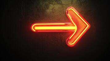 Bright neon arrow sign pointing right against a dark textured wall in a modern urban setting at night photo