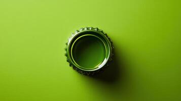 Green bottle cap lies on a vibrant surface in a minimalistic and artistic arrangement showcasing color contrast photo