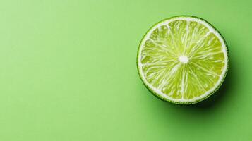 Lime half on a bright green background highlighting fresh fruit and vibrant colors photo