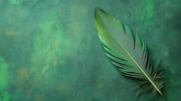 Vibrant green feather resting on textured green background in serene natural setting photo