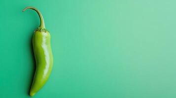 Fresh green chili pepper on a vibrant background perfect for culinary use and ingredient preparation photo