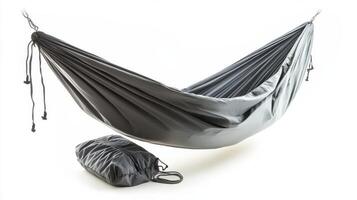 Relaxing in a portable hammock perfect for outdoor adventures and backyard lounging during summer days photo