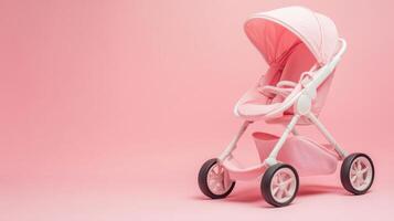 Pink stroller displayed against a soft pink backdrop, showcasing a stylish and modern design for infants and toddlers photo
