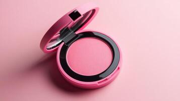 Bright pink blush compact open on a pastel pink background showcasing vibrant color and sleek design photo