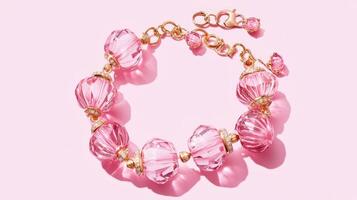 A pink bracelet with gold and pink beads photo