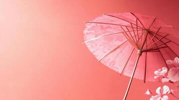 Pink parasol against a vibrant backdrop with floral accents showcasing elegance and charm in a creative display photo