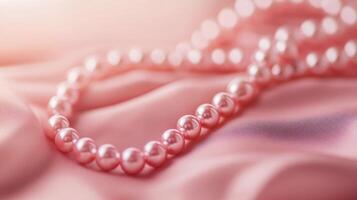 Elegant pink pearl necklace resting on soft satin fabric during a serene moment of luxury photo