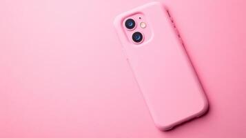 Pink smartphone rests on a pastel surface, showcasing modern design and aesthetic appeal in a minimalistic setting photo