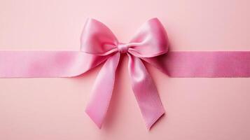 Elegant pink ribbon bow on a soft pastel background ideal for gifts and celebrations photo
