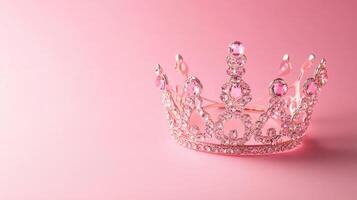 Sparkling pink crown placed on a soft pink background showcasing elegance and charm for celebrations and special occasions photo