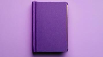 Purple hardcover book resting on a flat surface with a smooth texture and vibrant color photo