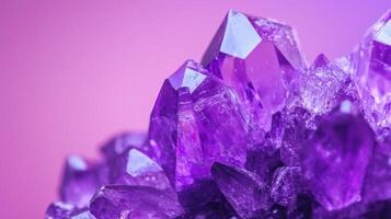 Amethyst crystal on purple background photo