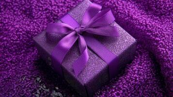 Purple gift box on a purple blanket photo