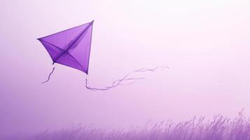 A purple kite flying in the sky photo