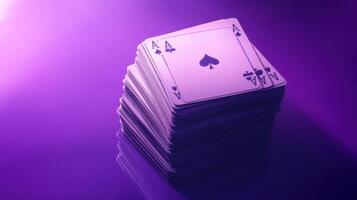 A stack of playing cards on a purple background photo