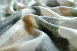 Soft plaid blanket with folds creating cozy texture . photo