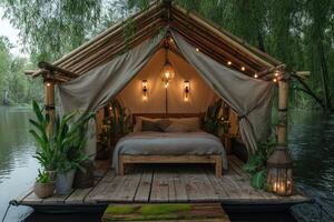 Floating bamboo bungalow with hanging lamps illuminating tranquil river retreat. photo