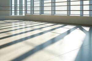 Sunlight creating shadows on empty office floor by window photo