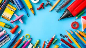 Colorful Stationery Items on Vibrant Blue Background for Creativity photo