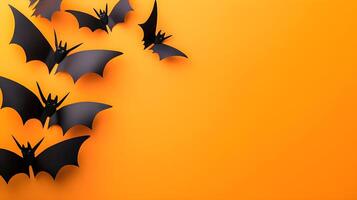 Black Bats Flying on Orange Background for Halloween Decorations photo