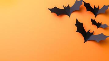 Black Paper Bats on Orange Background for Halloween Decor Ideas photo