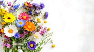 Vibrant Colorful Wildflower Bouquet in a Jar Against White Background photo
