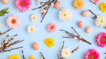 Colorful Spring Flowers and Easter Eggs on Blue Background photo