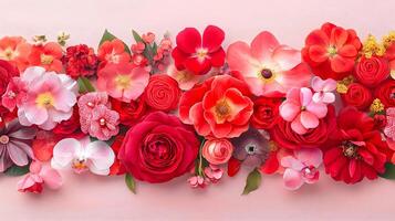 Vibrant Floral Arrangement in Shades of Red and Pink on Light Background photo