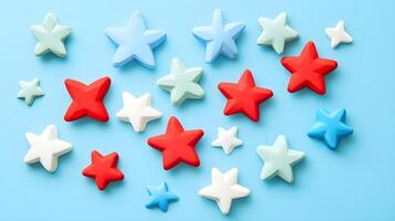Colorful Stars in Red, Blue, and White on Soft Blue Background photo