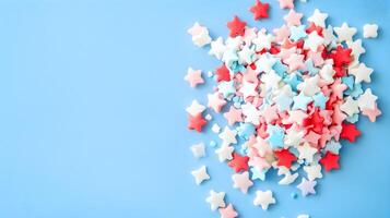Colorful Star-Shaped Sprinkles on Blue Background for Celebration photo